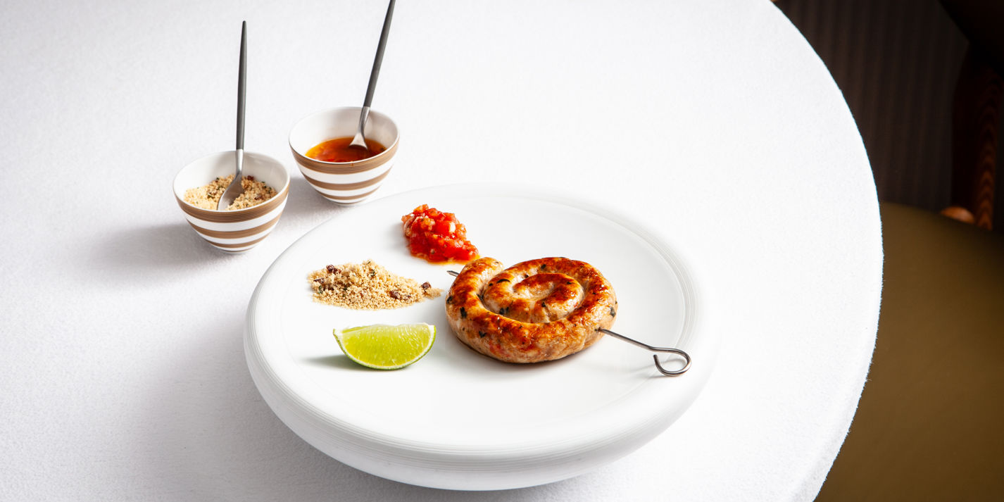 Chicken sausage with farofa and tomato vinaigrette
