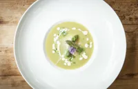 Cream of asparagus soup with flaked smoked haddock