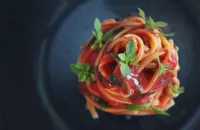 Spaghetti alla chitarra with plum tomato sauce, olives and basil
