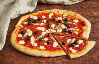 Barbecued pizza with passata, anchovies and goat's cheese