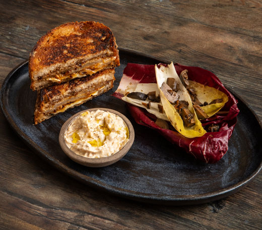 Buttered pear, brie and manchego toastie with onion crème fraîche
