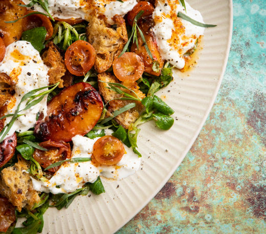 Confit tomato, grilled peach and stracciatella salad  