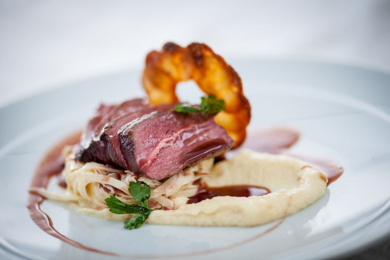 Venison loin with celeriac remoulade, pomme Maxine and juniper jus