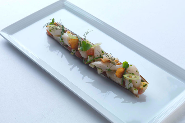Razor clams with spring onions and almond