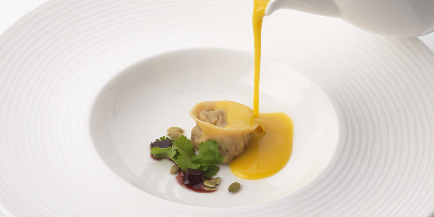 Duck confit tortellini with butternut squash velouté and soya jelly
