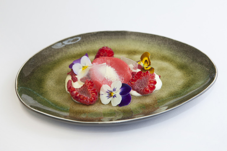 Raspberries with violet and oatmeal