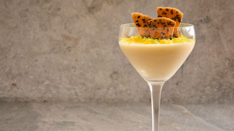 Yuzu posset with a black sesame tuile