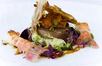 Rolled pig's head with langoustine and a crispy ear salad