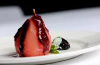 Stewed pear with winter berry coulis, fennel and ginger ice cream
