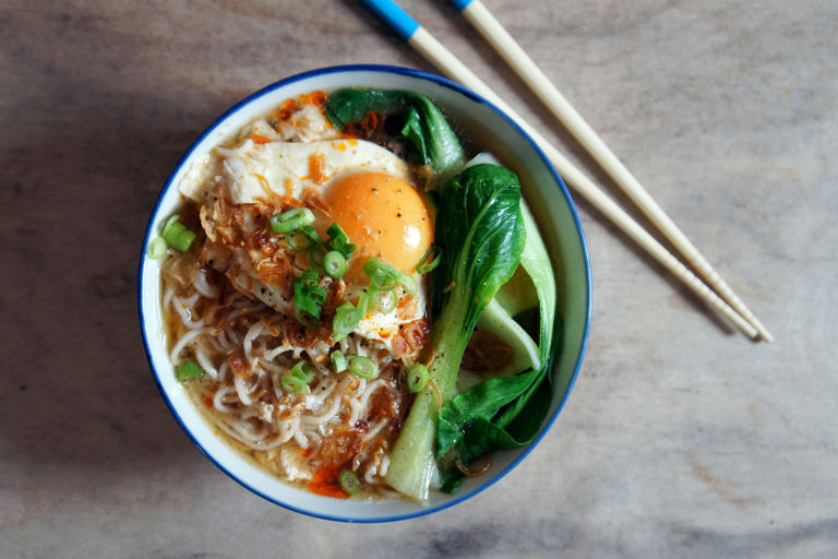 Miso ramen soup with pak choi, poached egg, and crispy shallots