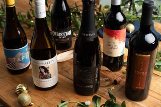 Six bottles of wine on a festively dressed table