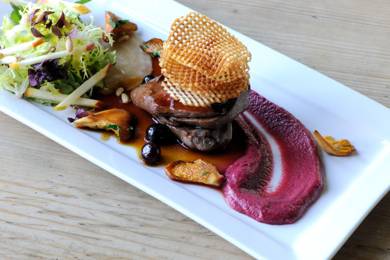 Wood pigeon with blueberry jus, beetroot purée and potato crisps