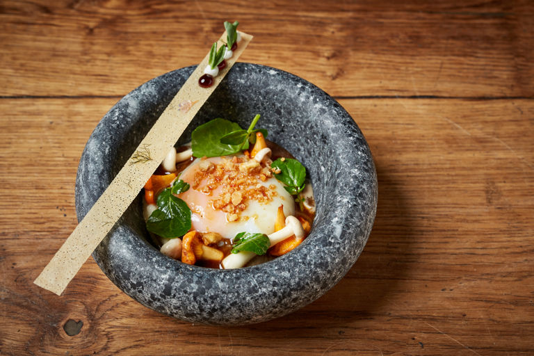 Slow-cooked hen's egg with girolles, hazelnuts and goat's curd 