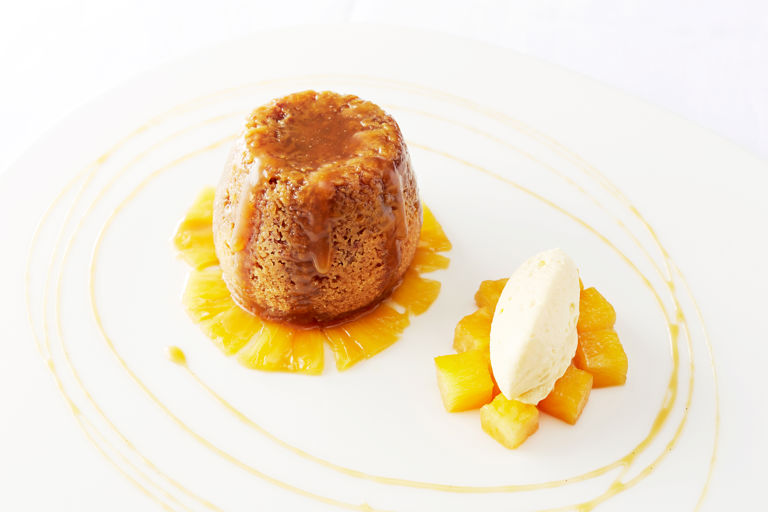 Sticky ginger pudding, marinated pineapple, mango cream and ginger beer syrup