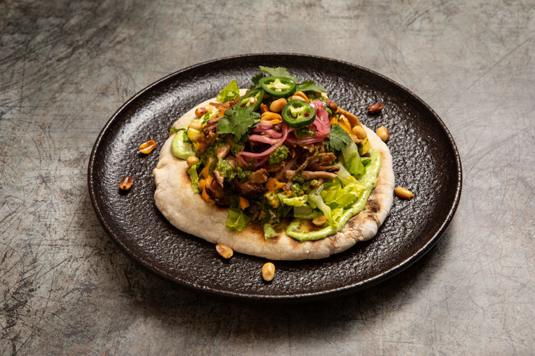 Pulled pork flatbreads with mango-avocado salsa, pistachio pesto and pickled onions