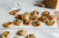 Pastry snails with basil pesto, Grana Padano and pine nuts 