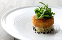 Salmon fish cakes with rocket, capers and lime dressing 