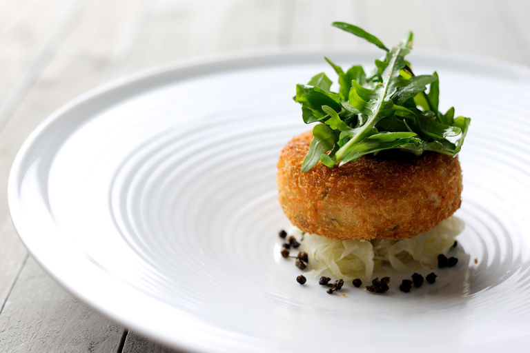 Salmon fish cakes with rocket, capers and lime dressing 