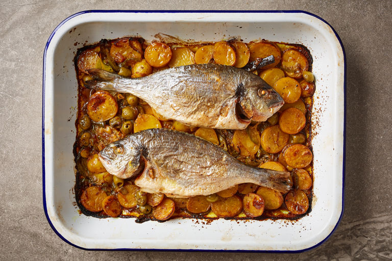 Baked sea bream with new potatoes, olives and preserved lemons