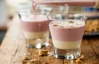 Rhubarb smoothie topped with custard and granola