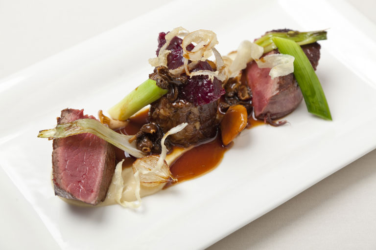 Fillet of beef with braised oxtail, textures of onion and morel Madeira sauce