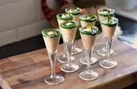 Salmon and crème fraiche shots topped with watercress purée and pickled cucumber