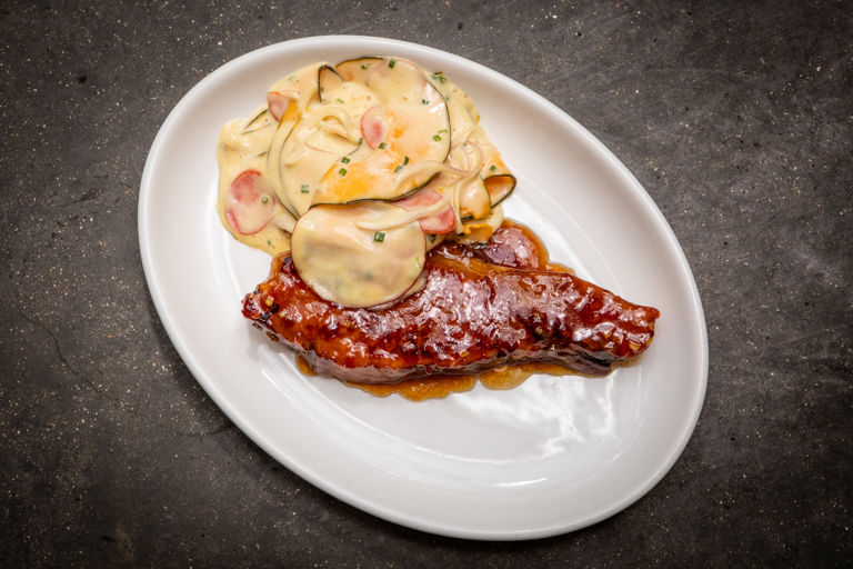 Pork chop with plum glaze and winter slaw