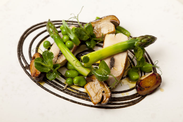 Chicken with black garlic, mushrooms and asparagus