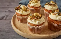 Spiced spelt and carrot cupcakes with white chocolate buttercream and pumpkin seed brittle